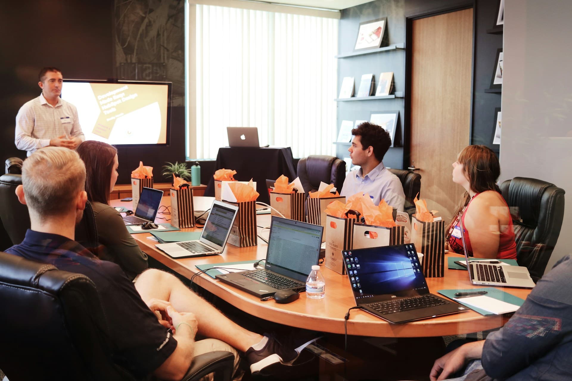 company-people-sitting-around-table